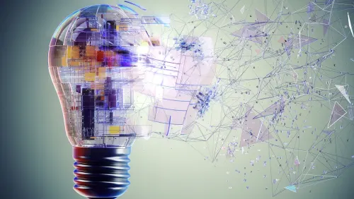 Abstract light bulb morphing into a digital network of lines and polygons, symbolizing innovation and technology